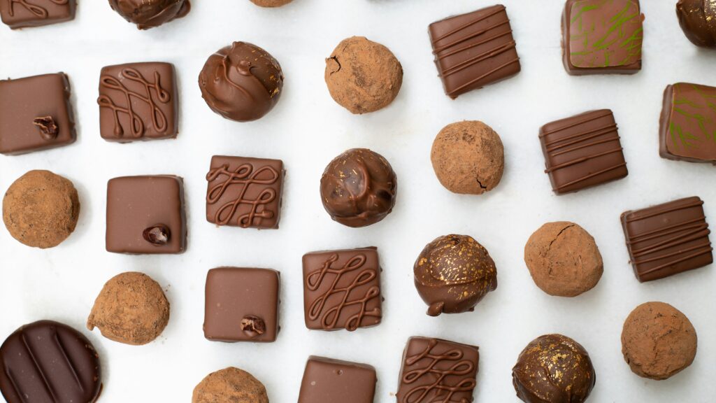 Overhead shot of multiple Individual chocolates spread evenly 